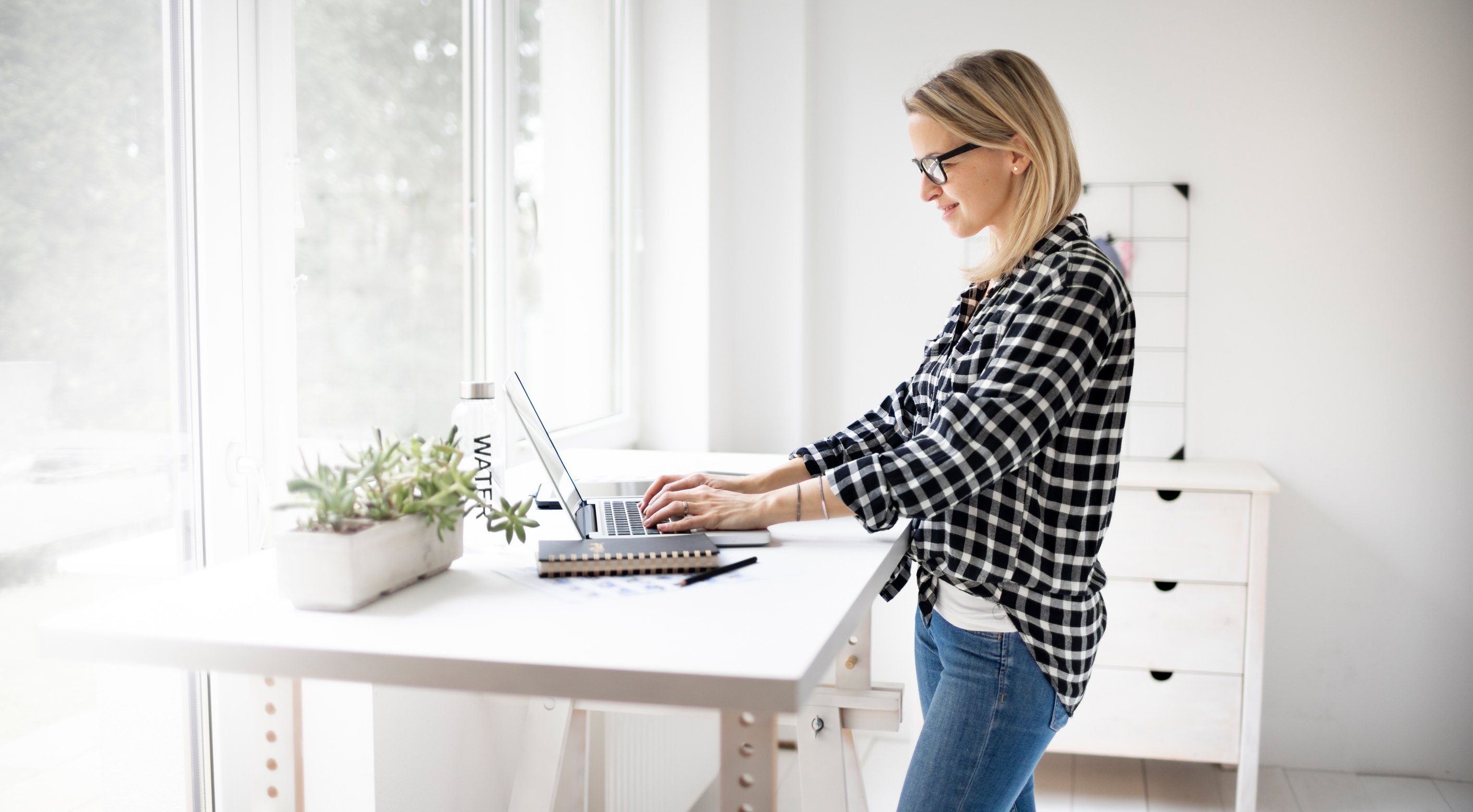 Woman Working on a Standing Desk 