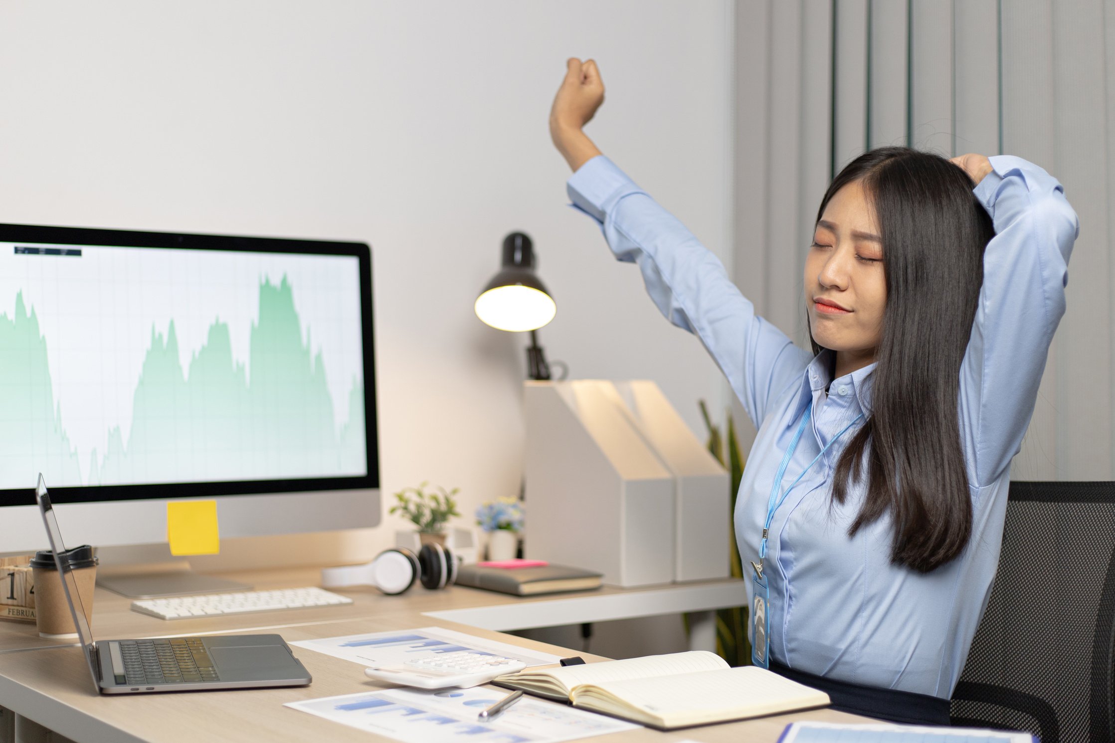 Woman in Office Stretching